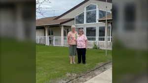 Patricia Henderson (left) and Cathy Finkle (right) stand in front of Cari-Villa days after finding out the senior housing complex will not be rebuilt. Courtesy: Jennifer Henderson