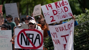 People protest the National Rifle Association's annual meeting in Houston, Friday, May 27, 2022. (AP Photo/Jae C. Hong) 
