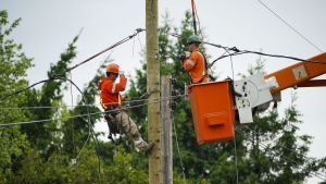 Hydro crews work to restore power in Clarence-Rockland, Ont., where a state of emergency is in place on Thursday, May 26, 2022. THE CANADIAN PRESS/Sean Kilpatrick