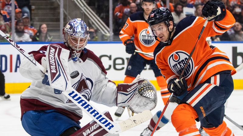 Colorado Avalanche goalie Darcy Kuemper (35) makes the save as Edmonton Oilers' Zach Hyman (18) looks for the rebound during second period NHL action in Edmonton, Friday, April 22, 2022 (The Canadian Press/Jason Franson).