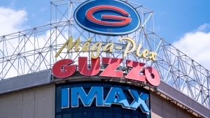 A Guzzo cinema sign is seen on a store front in Montreal on Tuesday, June 18, 2019. THE CANADIAN PRESS/Paul Chiasson