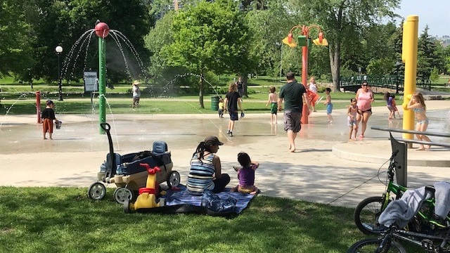 Families cool off at the splash pad at Breithaupt Park in Kitchener. (Dave Pettitt/CTV Kitchener)