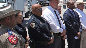 Uvalde School Police Chief Pete Arredondo, third from left, stands during a news conference outside of the Robb Elementary school in Uvalde, Texas Thursday, May 26, 2022. (AP Photo/Dario Lopez-Mills)