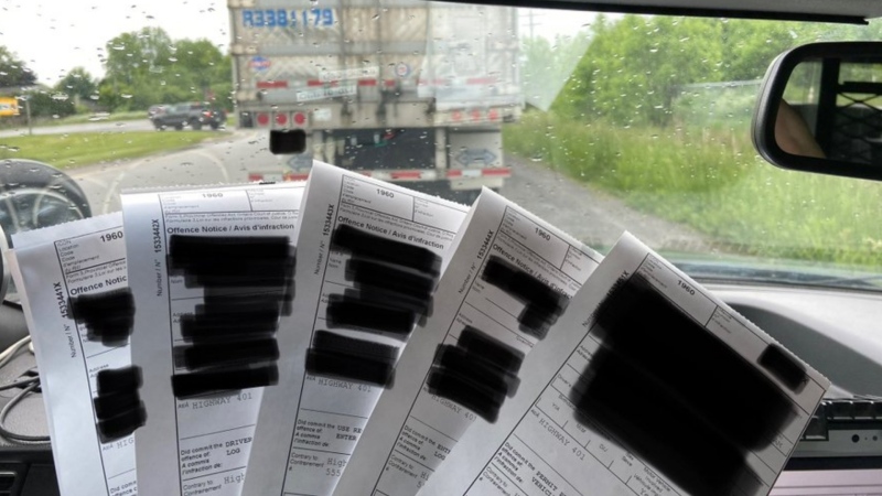 Ontario Provincial Police allege a transport truck driver was caught using FaceTime on his phone while driving on Highway 401 in eastern Ontario. (@OPP_ER/Twitter)