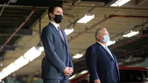 Prime Minister Justin Trudeau (left) stands alongside Ontario Premier Doug Ford as they make an announcement at a Honda plant in Alliston, Ont., on Wednesday, March 16, 2022. THE CANADIAN PRESS/Chris Young