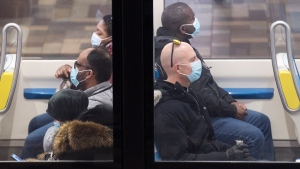 People wear face masks as they commute via metro in Montreal, Saturday, October 31, 2020, as the COVID-19 pandemic continues in Canada and around the world. THE CANADIAN PRESS/Graham Hughes