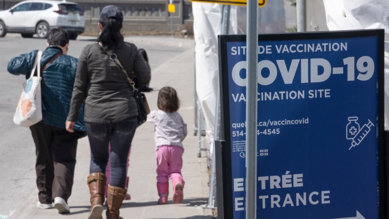 People leave a COVID-19 vaccination clinic on April 6, 2022 in Montreal. (THE CANADIAN PRESS/Ryan Remiorz)