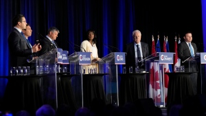 Conservative leadership hopefuls Pierre Poilievre, left to right, Patrick Brown, Scott Aitchison, Leslyn Lewis, Jean Charest and Roman Baber take part in the Conservative Party of Canada French-language leadership debate in Laval, Quebec on Wednesday, May 25, 2022. (THE CANADIAN PRESS/Ryan Remiorz)