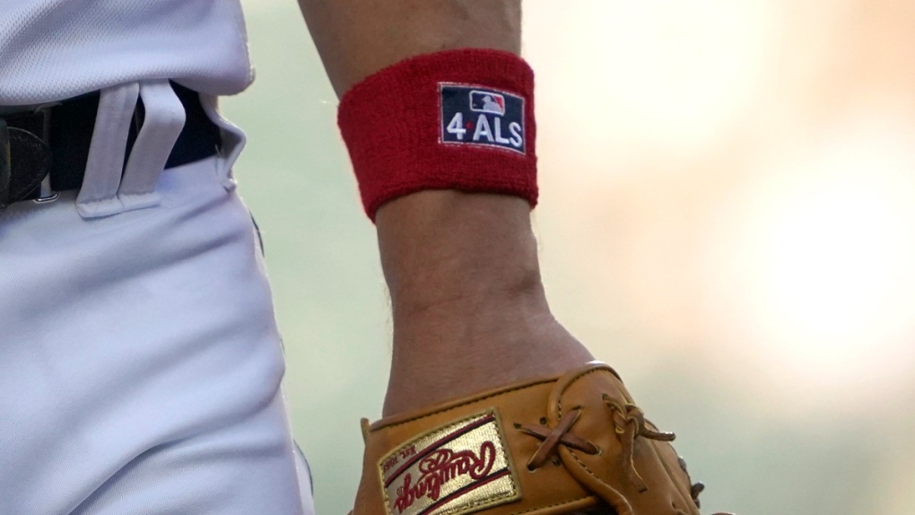 A red wristband with the MLB logo and '4ALS'
