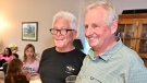 Malcolm Ives (left) and Bob Huson share a drink and a laugh at Bob’s Ottawa home. (Joel Haslam/CTV News Ottawa)