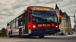 An OC Transpo bus turns onto Elgin St. from Wellington St. in downtown Ottawa, Ont. in this undated photo. (Photo by Shubham Sharan on Unsplash)