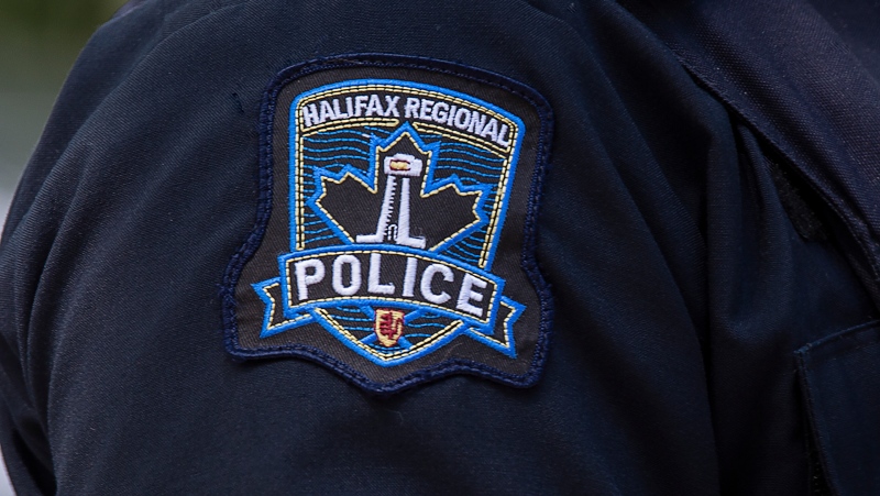 A Halifax Regional Police emblem is seen as police officers attend a murder scene in Halifax on Thursday, July 2, 2020. THE CANADIAN PRESS/Andrew Vaughan 