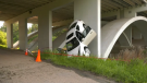 A white car was found resting on its nose end against a pier of Campbell Bridge at Fox Drive and Whitemud Drive in the early morning of June 16, 2022.