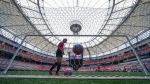 Youth soccer players kick a ball around on the field at B.C. Place stadium during a gathering to watch Vancouver be chosen as one of the host cities for the 2026 FIFA World Cup, in Vancouver, on Thursday, June 16, 2022. THE CANADIAN PRESS/Darryl Dyck 