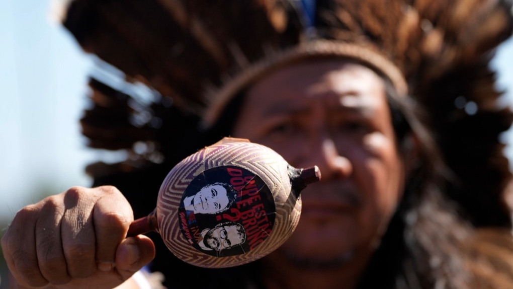Maraca with images of Dom Phillips, Bruno Pereira