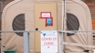 A COVID-19 clinic triage tent is seen outside a health facility in Kuujjuaq, Que., Sunday, May 8, 2022. THE CANADIAN PRESS/Adrian Wyld