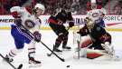 Montreal Canadiens left wing Michael Pezzetta (55) tries to control the puck in front of Ottawa Senators goaltender Anton Forsberg (31) during third period NHL hockey action in Ottawa on Saturday, April 23, 2022. (Justin Tang /THE CANADIAN PRESS)