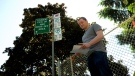 Myles Loosley-Millman is seen in this photograph next to a parking sign where he was ticketed.