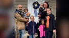 The Malezhyk family is pictured outside their new home in Rosthern. (Submitted photo)