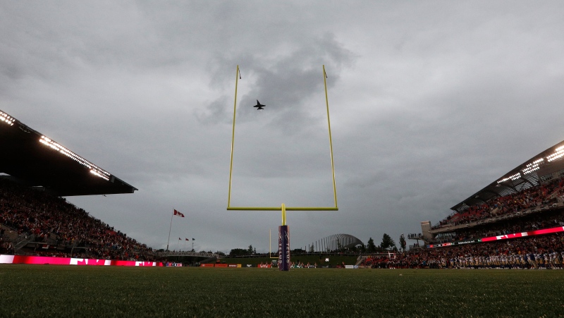An F18 does a flyby before the game between Ottawa Redblacks and the Winnipeg Blue Bombers at TD Place Stadium in Ottawa on Friday June 17, 2022. THE CANADIAN PRESS/Lars Hagberg