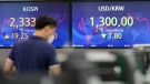 Screens showing the Korea Composite Stock Price Index (KOSPI), left, and the foreign exchange rate between U.S. dollar and South Korean won at a foreign exchange dealing room in Seoul, South Korea, on June 24, 2022. (Lee Jin-man / AP)
