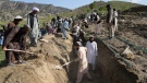 Afghans dig a trench for a common grave for earthquake victims in Gayan village, in Paktika province, Afghanistan, on June 23, 2022. (Ebrahim Nooroozi / AP)