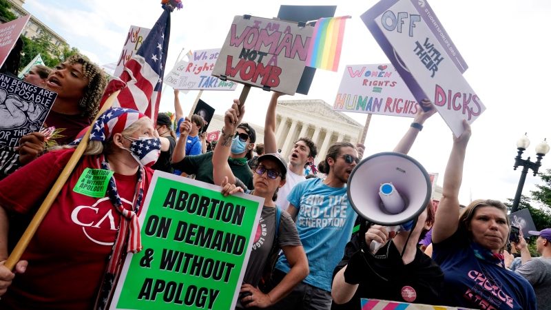 People protest about abortion, Friday, June 24, 2022, outside the Supreme Court in Washington. (AP Photo/Steve Helber) 