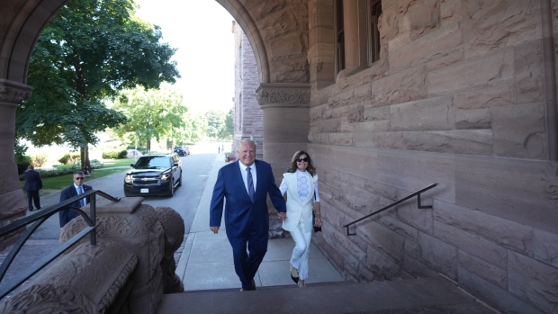 Premier Doug Ford and his wife Karla Ford arrive to announce his new cabinet at the swearing-in ceremony at Queen’s Park in Toronto on June 24, 2022. THE CANADIAN PRESS/Nathan Denette