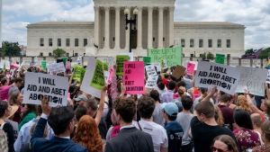 Abortion-rights protesters regroup and protest following U.S. Supreme Court's decision to overturn Roe v. Wade, federally protected right to abortion, in Washington, Friday, June 24, 2022. (AP Photo/Gemunu Amarasinghe)