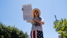 Abortion-rights advocate Eleanor Wells, 34, chants her slogan during a protest in Los Angeles, Friday, June 24, 2022. The Supreme Court has ended constitutional protections for abortion that had been in place nearly 50 years in a decision by its conservative majority to overturn Roe v. Wade. (AP Photo/Jae C. Hong)