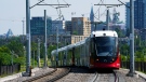 An Ottawa Light Rail Transit (OLRT) train travels along the tracks in Ottawa on Wednesday, June 22, 2022. The Ottawa Light Rail Transit Public Inquiry which is currently underway is being led by Commissioner Justice William Hourigan and will present findings and final report by the end of August 2022. (Sean Kilpatrick/THE CANADIAN PRESS)