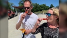 Hundreds of people stood in line in order to try the ketchup-flavoured "Frenchsicle" popsicle in Leamington, Ont. on June 24, 2022. The popsicle was a hit hit amongst those who tried the frozen treat. (Christopher Campbell/CTV News Windsor)