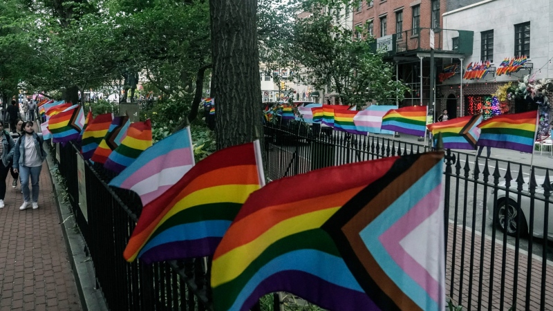 Flags affirming LGBTQ identity dress the fencing surrounding the Stonewall National Monument, Wednesday, June 22, 2022, in New York. Sunday's Pride Parade wraps a month marking the anniversary of the June 28th, 1969, Stonewall uprising, sparked by a police raid on a gay bar in Manhattan and a catalyst of the modern LGBTQ movement. (AP Photo/Bebeto Matthews)