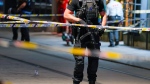 Police gather at the site of a mass shooting in Oslo, early Saturday, June 25, 2022. (Javad Parsa/NTB via AP)