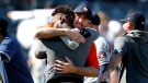 Houston Astros starting pitcher Cristian Javier, back to camera, receives a hug from pitcher Justin Verlander, right after a combined no-hitter against the New York Yankees, Saturday, June 25, 2022, in New York. (AP Photo/Noah K. Murray)