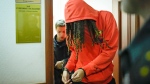 WNBA star and two-time Olympic gold medalist Brittney Griner leaves a courtroom after a hearing, in Khimki just outside Moscow, May 13, 2022. (AP Photo/Alexander Zemlianichenko, File)