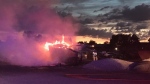 London fire crews battle a blaze at an auto wrecker yard on June 26, 2022. (Source: London fire/Twitter)