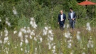 Prime Minister Justin Trudeau and Olaf Scholz, Chancellor of Germany, stroll at the G7 Summit in Schloss Elmau on June 27, 2022. (Paul Chiasson / THE CANADIAN PRESS)