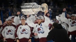 Colorado Avalanche center Nathan MacKinnon lifts the Stanley Cup after the team defeated the Tampa Bay Lightning in Game 6 of the NHL hockey Stanley Cup Finals on Sunday, June 26, 2022, in Tampa, Fla. (AP Photo/Phelan Ebenhack) 