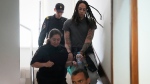 Brittney Griner is escorted to a courtroom for a hearing, in Khimki just outside Moscow, Russia, on June 27, 2022. (Alexander Zemlianichenko / AP) 