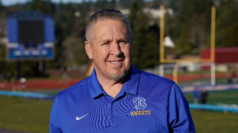 Joe Kennedy, a former assistant football coach at Bremerton High School in Bremerton, Wash., at the school's football field, on March 9, 2022. (Ted S. Warren / AP) 