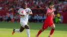 Canada's Nichelle Prince chases down the ball with Republic of Korea's Seonjoo Lim during second half international friendly women's soccer action Toronto, on Sunday June 26, 2022. (THE CANADIAN PRESS/Chris Young)