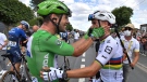 Mark Cavendish, in green, celebrates with Julian Alaphilippe after winning the sixth stage of the Tour de France in Chateauroux, France, July 1, 2021. (David Stockman, Pool Photo via AP)