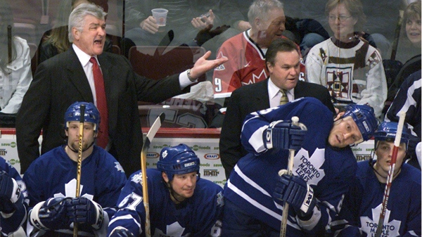 Toronto Maple Leafs GM and coach Pat Quinn, left, shows his displeasure with the referee as he stands beside assistant coach Rick Ley during NHL action against the Vancouver Canucks in Vancouver Saturday, March 16, 2003. (Chuck Stoody / THE CANADIAN PRESS)