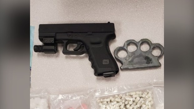 An air gun and brass knuckles seized by police are seen in a handout photo. (Submitted/Waterloo Regional Police Service)