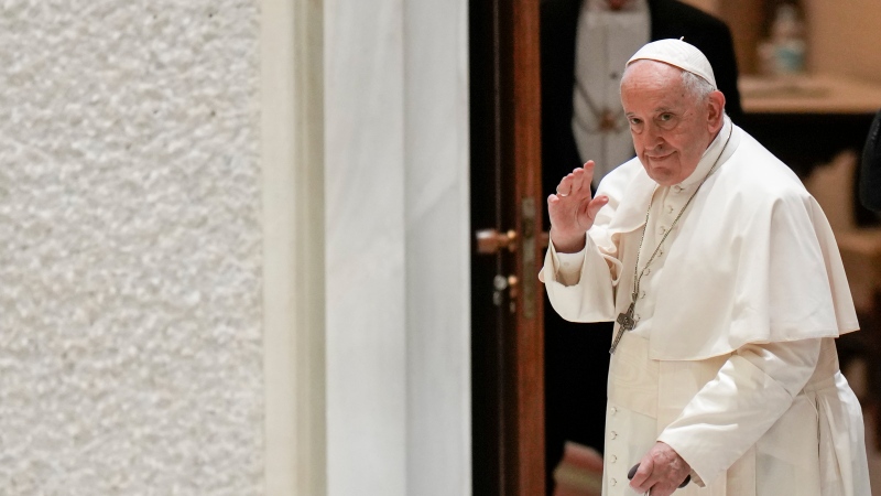 Pope Francis leaves at the end of a meeting with members of the Neocatechumenal Way community, in the Pope Paul VI hall at the Vatican, Monday, June 27, 2022. (AP Photo/Alessandra Tarantino)