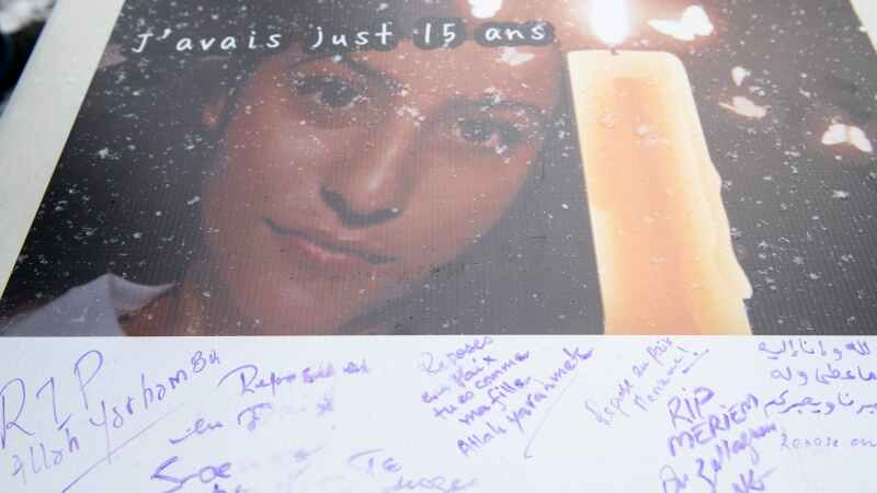 Messages are shown on a card during a vigil and protest against gun violence in memory of Meriem Boundaoui in Montreal, Sunday, Feb. 14, 2021. Boundaoui died in a drive by shooting last weekend. THE CANADIAN PRESS/Graham Hughes