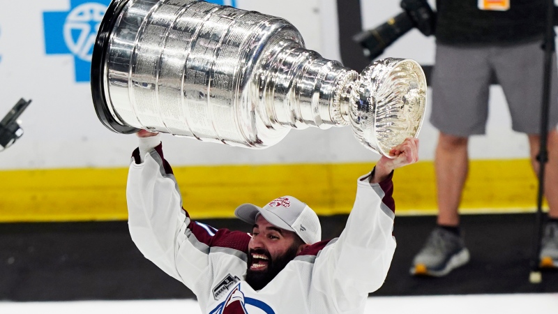 Colorado Avalanche center Nazem Kadri lifts the Stanley Cup after the team defeated the Tampa Bay Lightning 2-1 in Game 6 of the NHL hockey Stanley Cup Finals on Sunday, June 26, 2022, in Tampa, Fla. (AP Photo/John Bazemore)