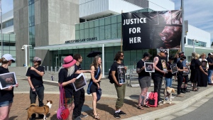 Supporters of animal activists stand outside the Abbotsford, B.C., law courts on Monday, June 27, 2022. (Scott Connorton / CTV News Vancouver)