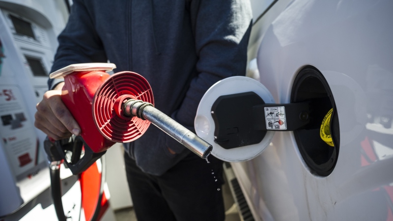A man fills up his truck with gas in Toronto, on Monday, April 1, 2019. THE CANADIAN PRESS/Christopher Katsarov